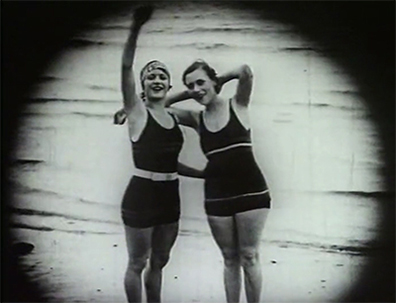 Two women on beach in A Takapuna Scandal (1928).