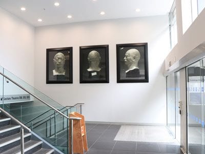 Three large scale photos by Fiona Pardington are shown in position in the entrance to the General Library.